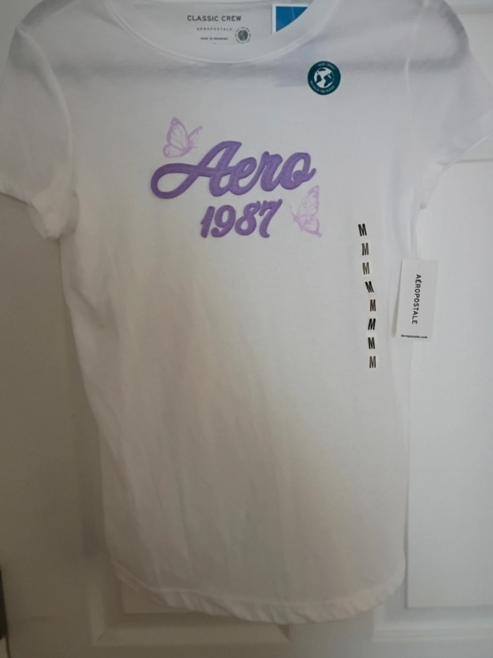 Aeropostale White Tee with Lavender 'Aero 1987' Script and Butterfly Accents